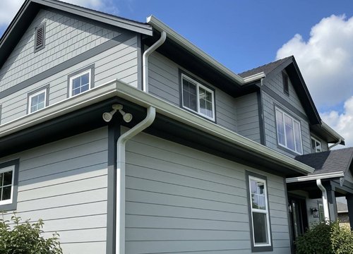 gutters and downspouts on a two-story home