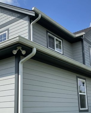 seamless gutter run formed on-site for a Houston home
