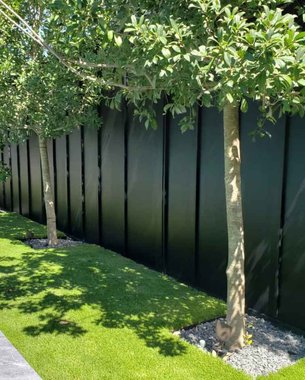 restored cedar fence matched to existing run