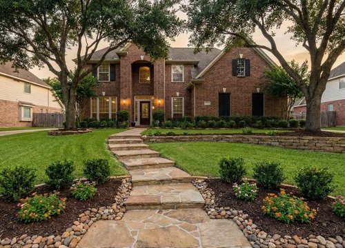 Houston landscaping and yard drainage to match gutter discharge