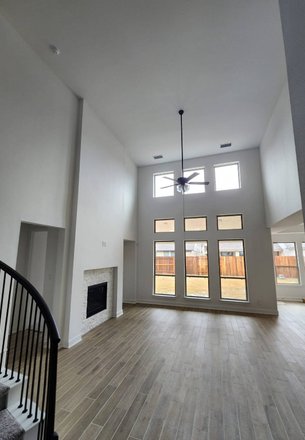 open two-story living room after interior remodeling