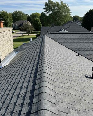 roofing crew tearing off old shingles on a Houston replacement job