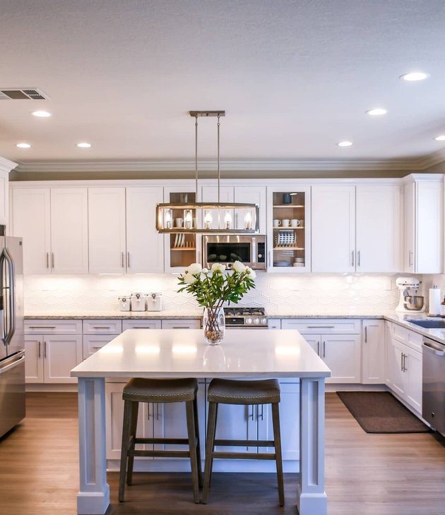 freshly painted white kitchen cabinets in a Houston home