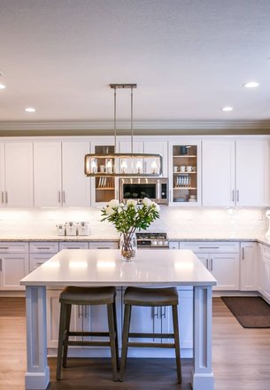 reinstalled freshly painted cabinet doors in a Houston kitchen