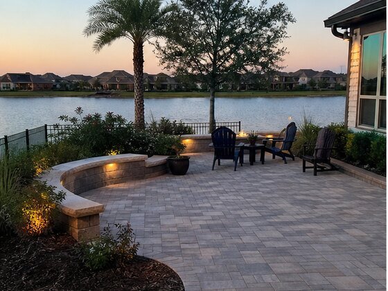 completed lake view paver patio in Towne Lake Cypress TX